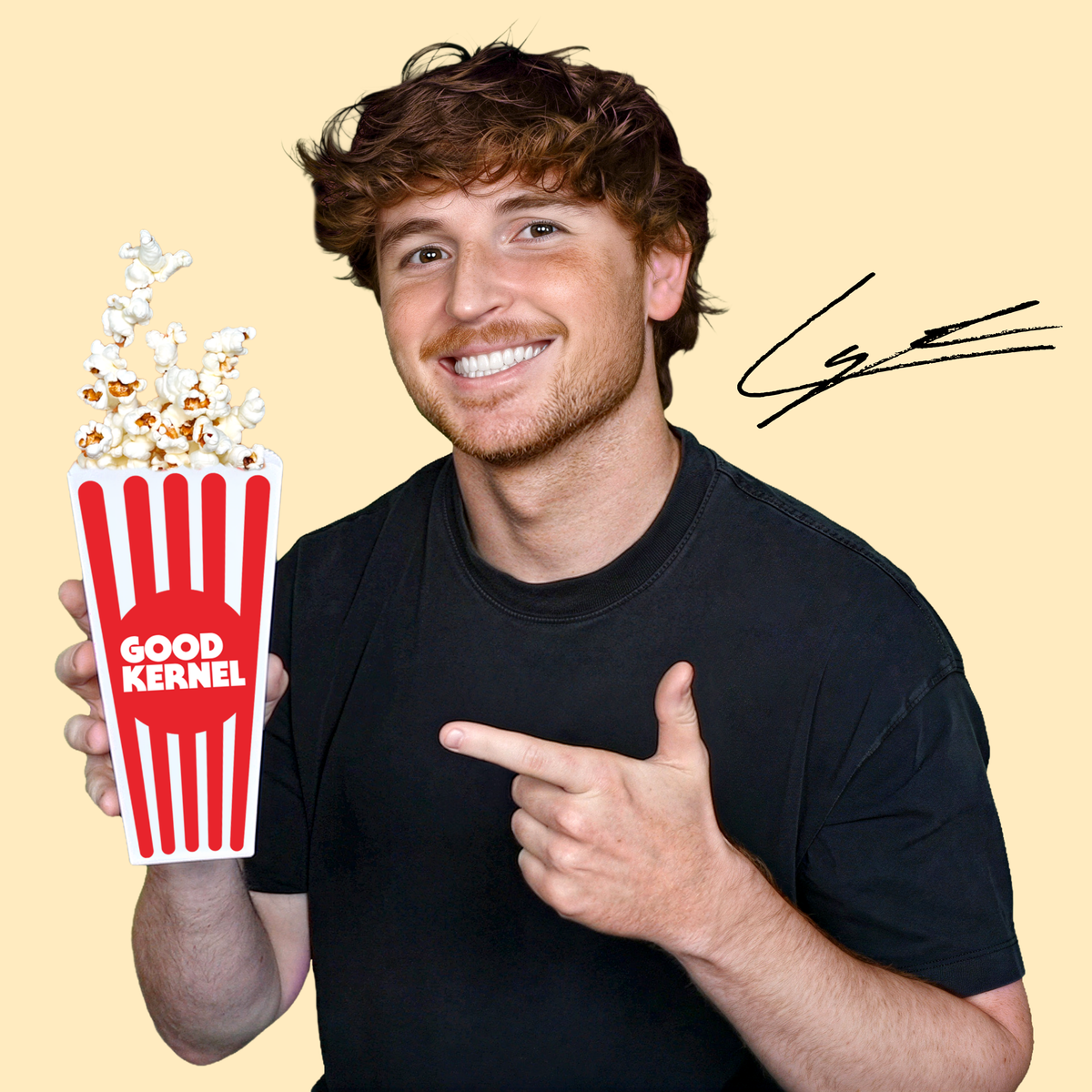 Caylus holding a Good Kernel popcorn bucket